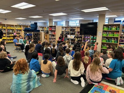 Photo of Author reading to students